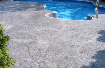 Textured and stamped gray pool deck.